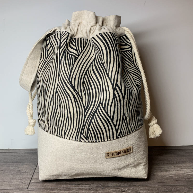 Large drawstring project bag with inner slip pockets and strap handle